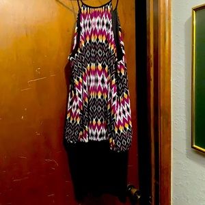 It is a black strapped mini dress